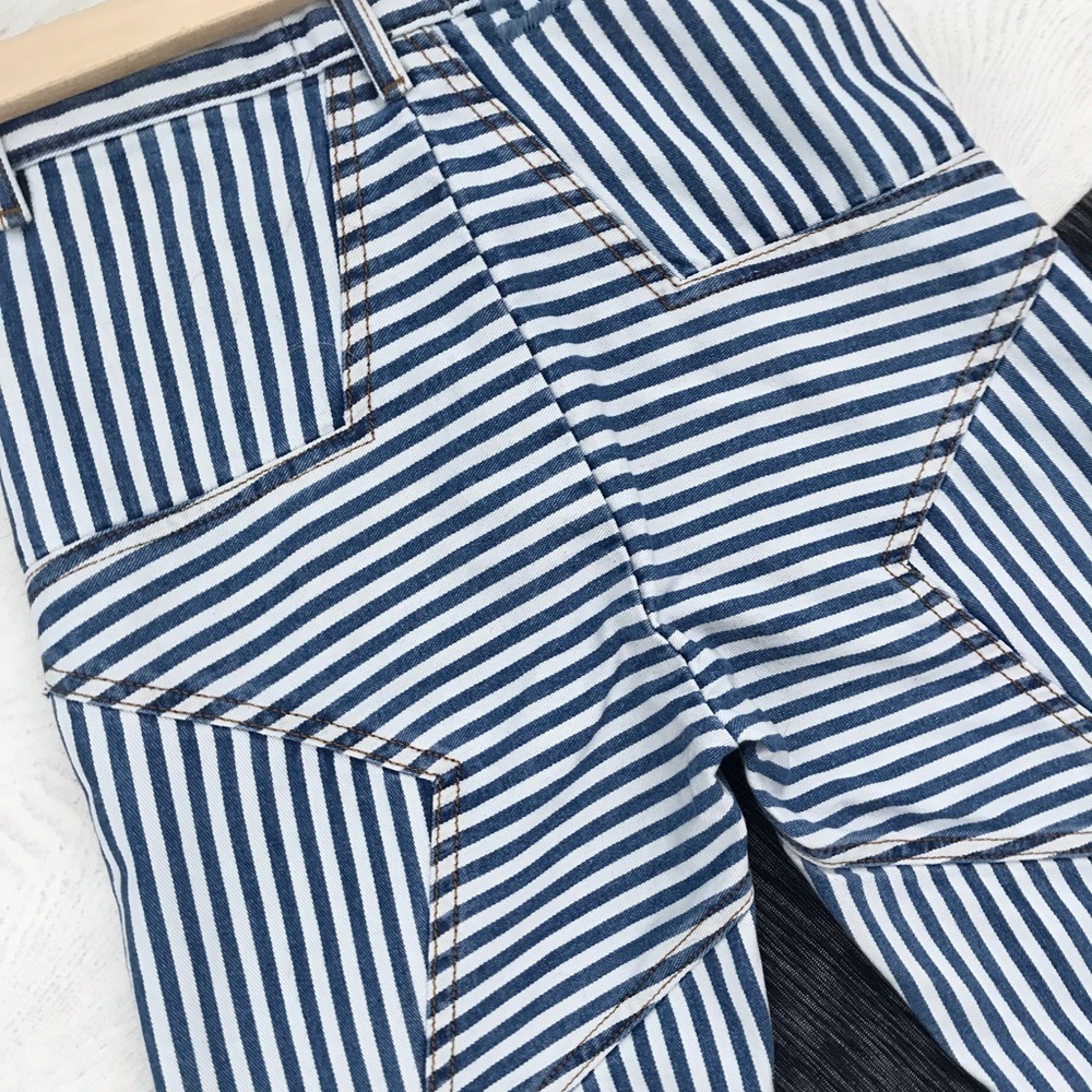 Pin striped flared denim jeans with booty star
